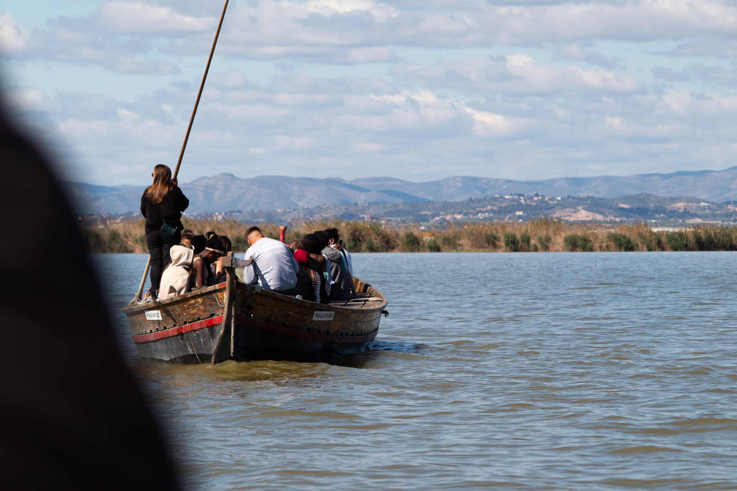 people on a boat at the albufera lake valencia in may